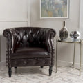 Fauteuil club capitonné en similicuir collé